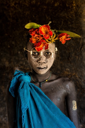 Portrait of a Suri Boy Adorned with Flowers and "Glasses" by John Rowe