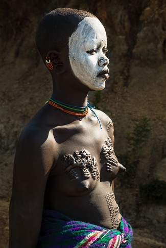 Portrait of a Suri Girl with Traditional Scarification by John Rowe