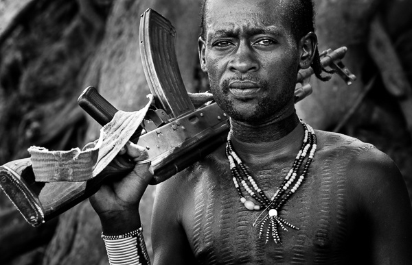 Portrait of a Hamer Man with AK-47 #1 by John Rowe