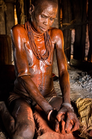 Hami Grinding Her Clay by John Rowe