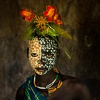 Portrait of a Suri Girl Adorned with Flowers